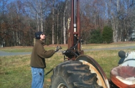 Chris manning the post driver
